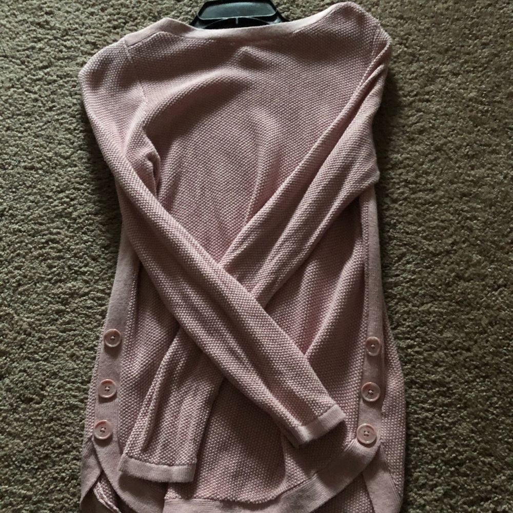 Pink knitted sweater with 3 buttons down the sides